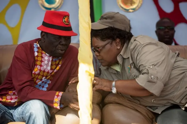 r Morgan Tsvangirai (L) speaks with Zimbabwean opposition figure Joyce Mujuru (R) during a "Zimbabwe People First" (ZPF) rally in Gweru, on August 13, 2016.