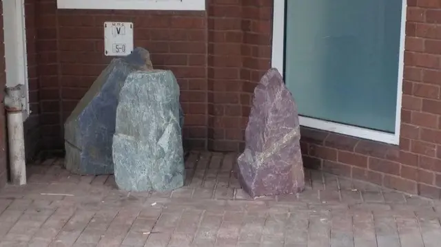 Rocks cemented outside Co-op Bank