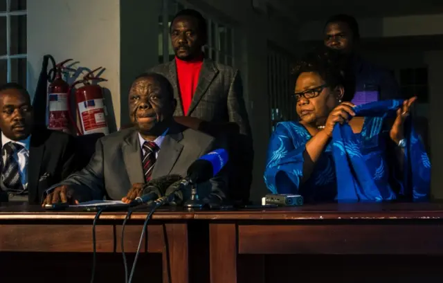 Zimbabwe main opposition leader Morgan Tsvangirai (L) and former vice president Joice Mujuru (R) sign a Memorandum of Understanding to negotiate a coalition ahead of the 2018 general election in Harare, April 19 2017