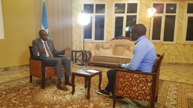 Ferdinand Omondi with Somalia's Prime Minister, Hassan Ali Khayre