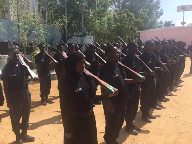 Somali woman pictured among other male police recruits at a parade