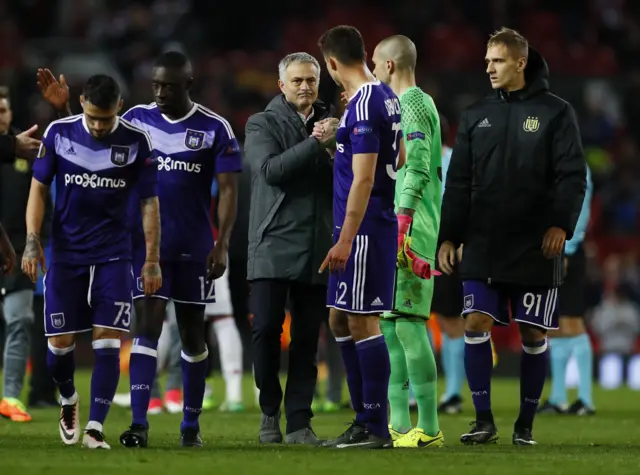 Jose Mourinho shakes hands with Leander Dendoncker