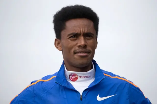 thiopia elite runner Feyisa Lilesa poses during a photocall for the men"s marathon elite athletes outside Tower Bridge in central London on April 20, 2017 ahead of the upcoming London Marathon