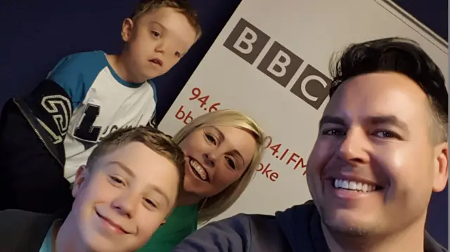 Harry, top, with big brother Oliver, mum Charlie and BBC Radio Stoke's John Acres