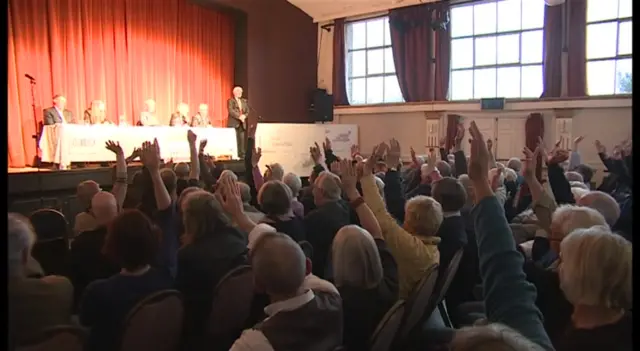 Show of hands at meeting