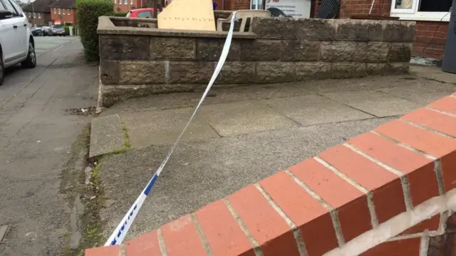 Police tape cordoned off one property