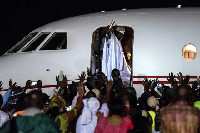 Jammeh waving from an aeroplane