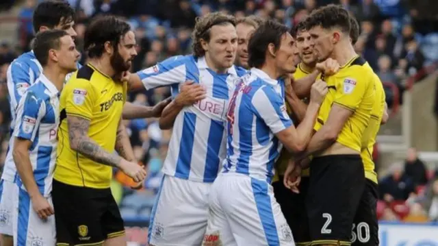 Dean Whitehead and Tom Flanagan were given yellow cards after grabbing each other