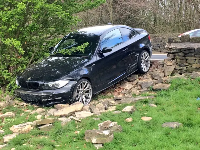 Car in wall