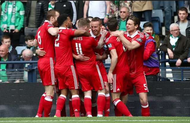 Adam Rooney celebrates his early opener at Hampden