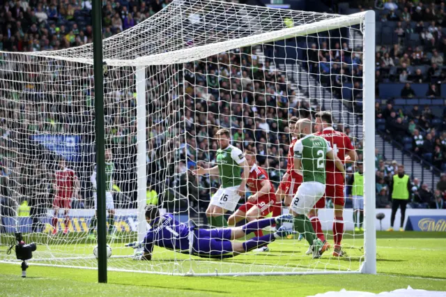 Ofir Marciano is caught out by Ryan Christie's clever free-kick from close to the right touchline