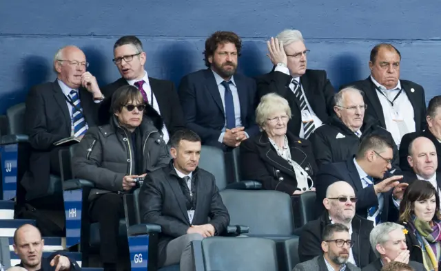 Gerard Butler watches the game