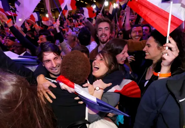 Supporters of centrist Emmanuel Macron react to Saturday's results, 23 April 2017