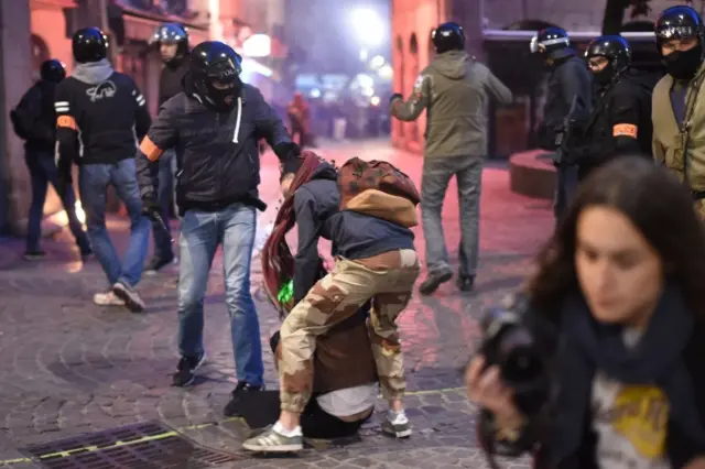 French police detain left-wing demonstrators during clashes in Nantes, western France, 23 April 2017