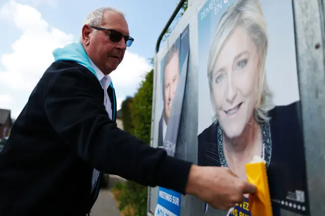 A campaign poster of French presidential election candidate Front National (FN) party Marine Le Pen is glued to a wall in France