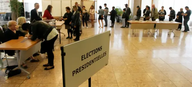 people wait to vote near Lyon