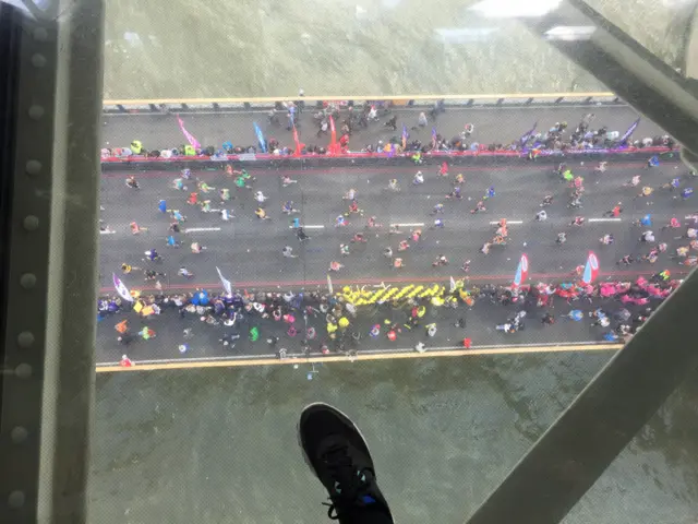 View looking down on runners on Tower Bridge