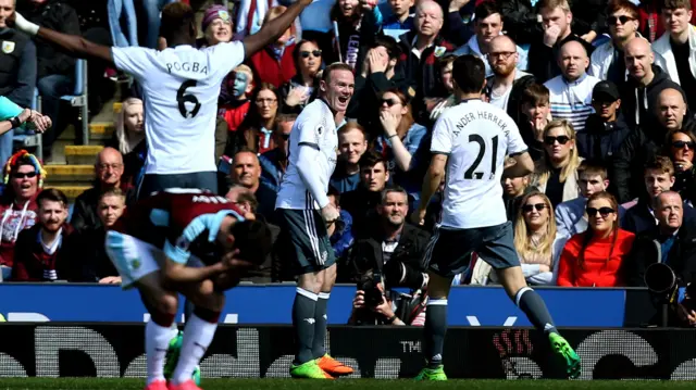 Wayne Rooney celebrates scoring United's second goal