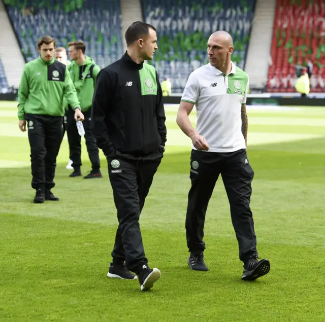 Scott Brown chats to Celtic assistant manager Chris Davies