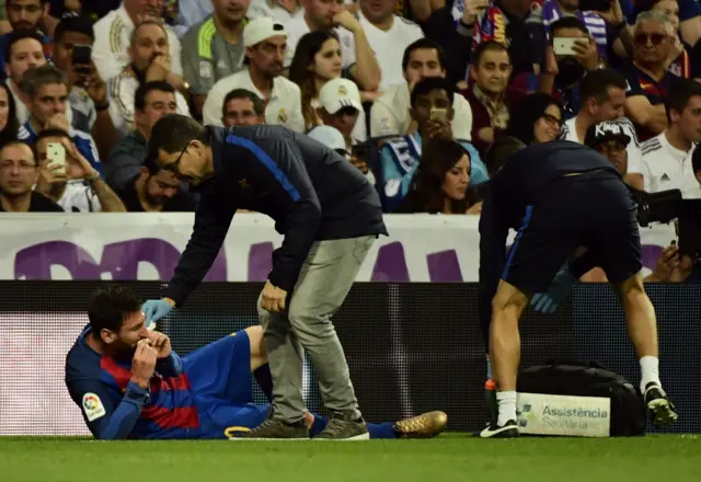 Messi has his mouth covered in blood