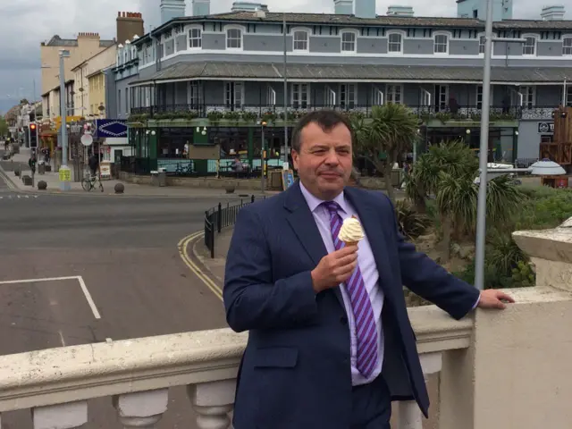 Arron Banks eating an ice cream in Clacton