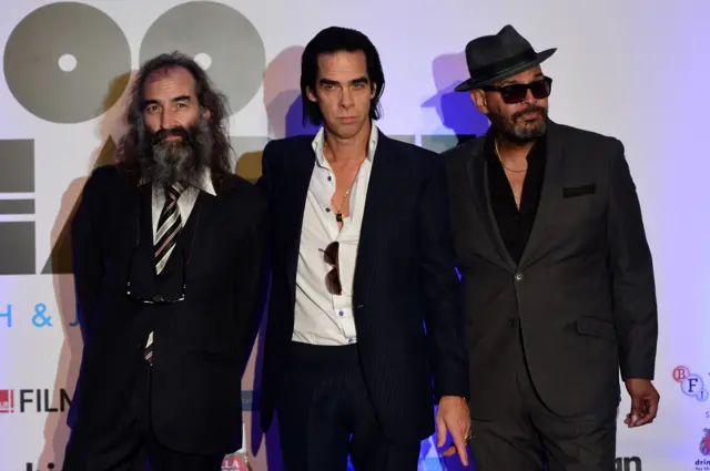 Warren Ellis (left) with Nick Cave and The Bad Seeds