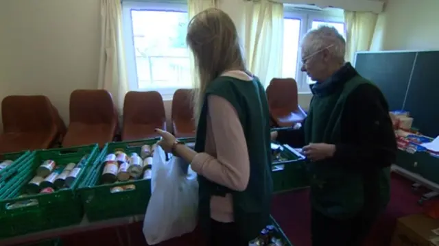 People picking up food in a food bank