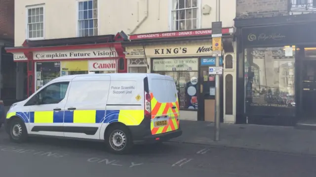 Police car outside newsagents