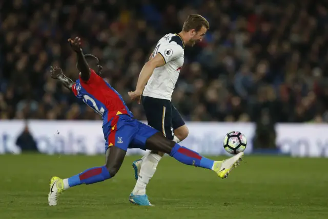 Harry Kane is challenged by Crystal Palace's Mamadou Sakho