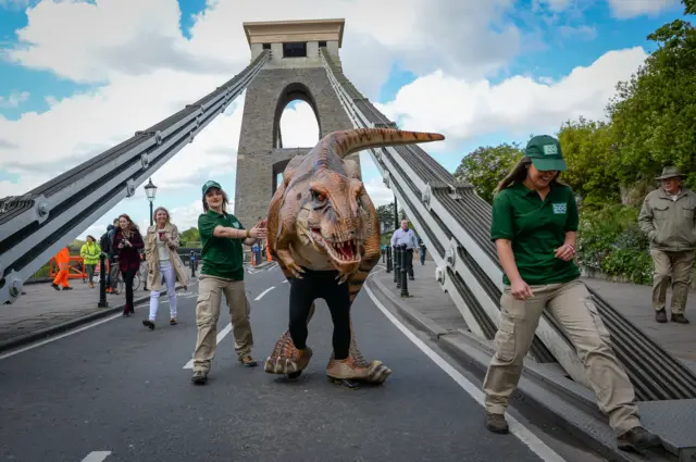 Dinosaur walking over Clifton Suspension Bridge