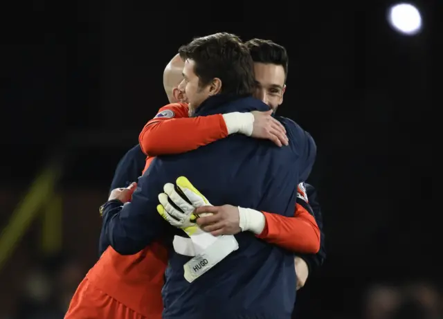 Mauricio Pochettino celebrates after the match with Hugo Lloris