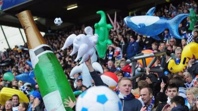 Football fans with inflatables