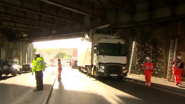 Lorry under bridge