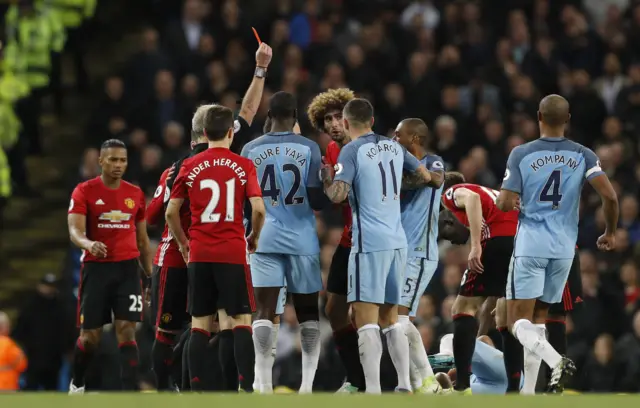 Manchester United's Fellaini gets a red card