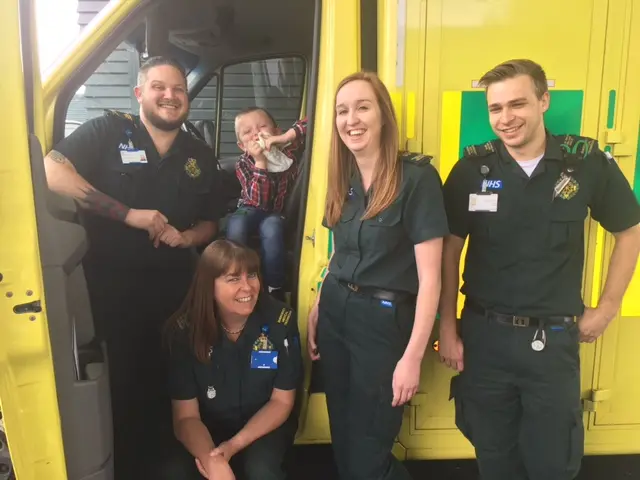 Alfie Hustwayte with the ambulance crew