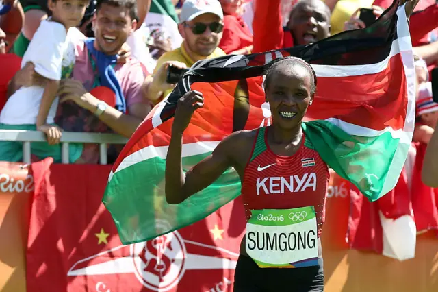 Jemima Jelagat Sumgong of Kenya celebrates after winning the gold medal in the Women's Marathon on Day 9 of the Rio 2016 Olympic Games