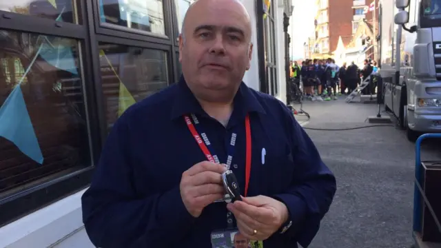 Andy Comfort holding the lead car key