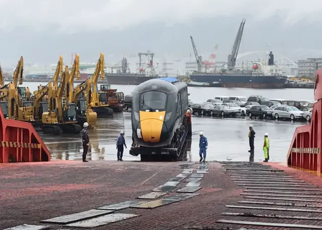 The test train being loaded at Kobe port, Japan