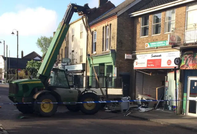 Digger outside Post Office after ram-raid