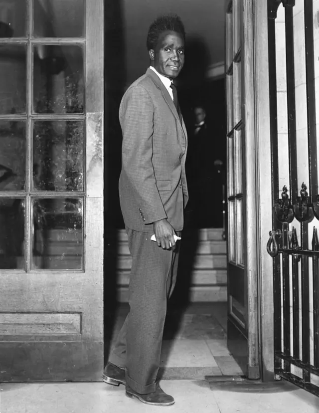 Kenneth Kaunda, leader of the Northern Rhodesian African Nationalists, arriving at the Colonial Office for talks with the British Government about his country's constitution.