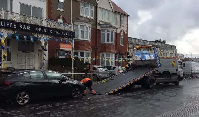 Car being towed away