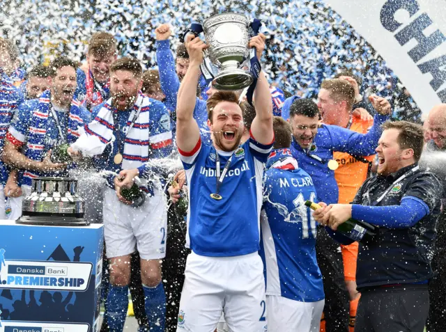 Blues skipper Jamie Mulgrew lifts the Gibson Cup at Solitude