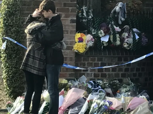 
          Lydia Wilkinson stood outside the family home where her mum and brother where stabbed
        