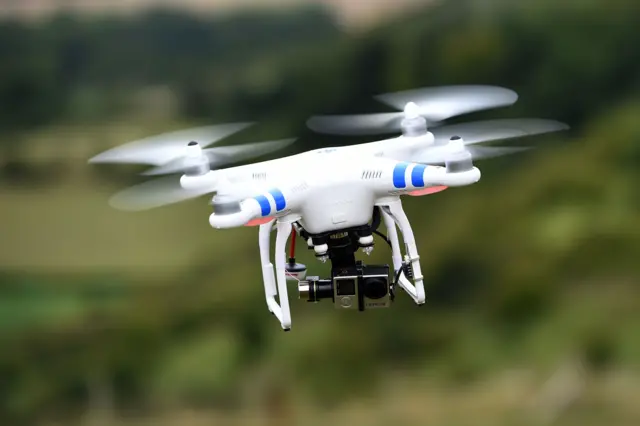 A drone hovering in mid flight