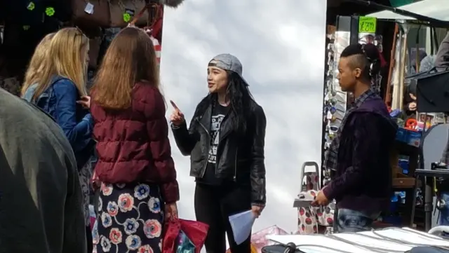 Florence Pugh chats to extras