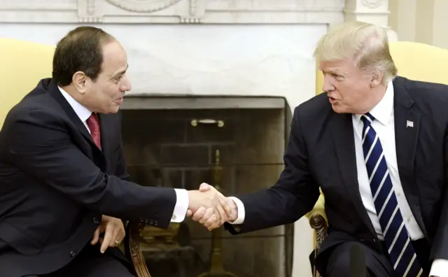 Trump and Sisi shake hands in the oval office