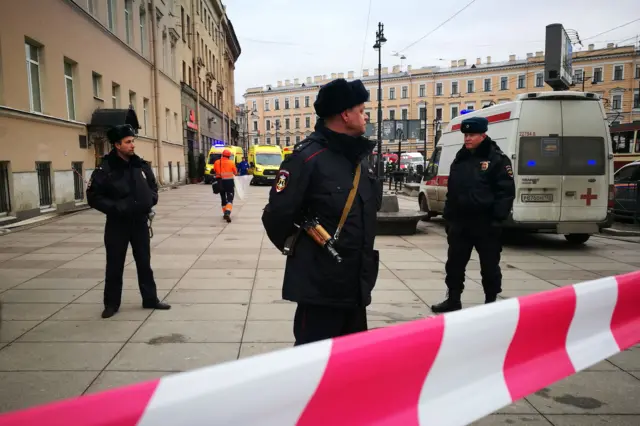 
          Police officers guard the area at the entrance to Technological Institute metro station in Saint Petersburg
        