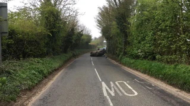 Overturned car between Holbrook and Freston