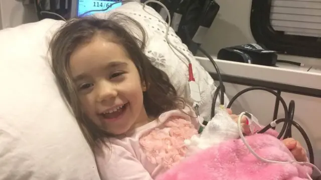 Christine Thomas in a hospital bed
