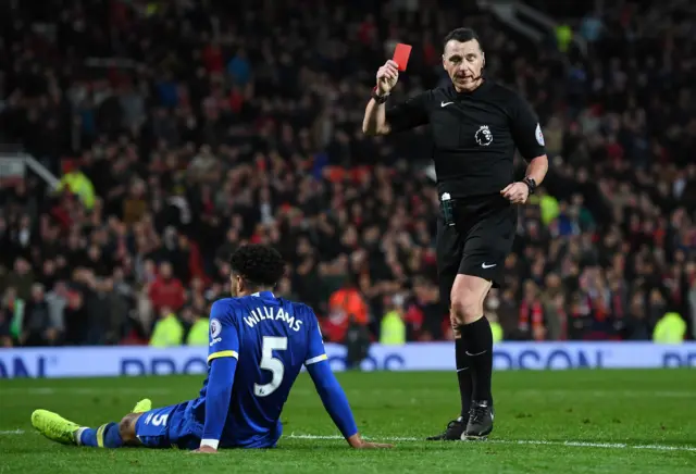 Ashley Williams of Everton is shown a red card